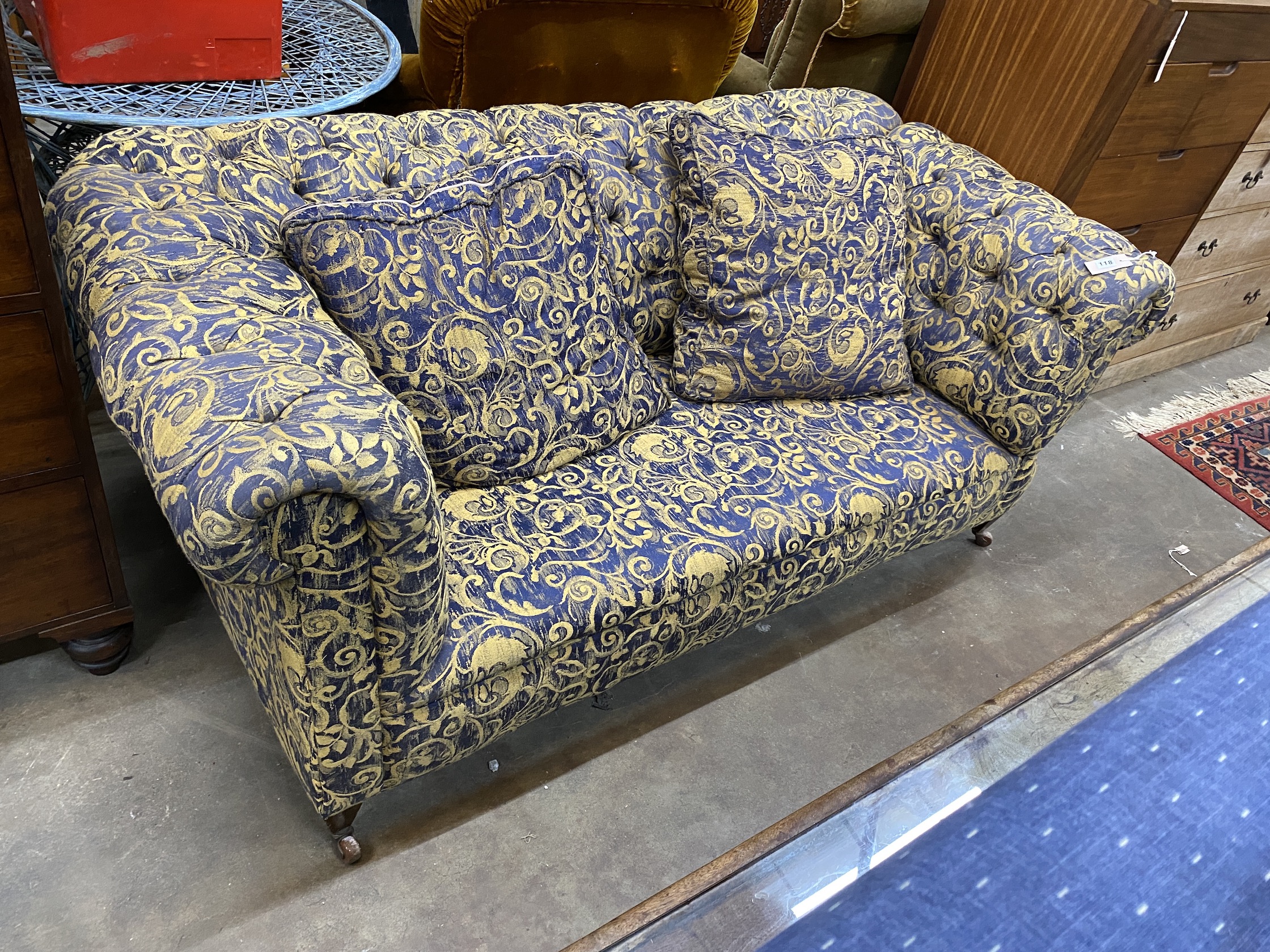 A Victorian upholstered drop-arm Chesterfield settee, width 170cm, depth 84cm, height 72cm